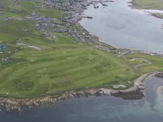 General oblique aerial view of the golf course at Point of Ness, looking ENE.