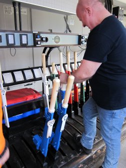 Interior. Signal Box. Signalman operating levers.