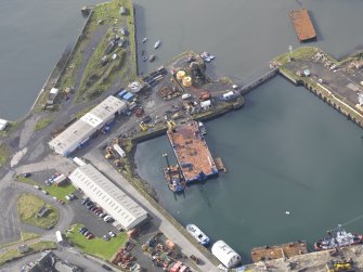 Oblique aerial view of Burntisland West Dock, looking to the SW.