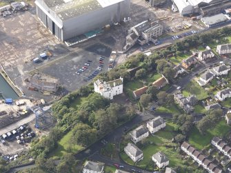 Oblique aerial view of Rossend Castle, looking to the SSW.