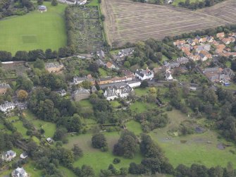General oblique aerial view of Inveresk Village Road centred on the Manor House, looking to the NE.