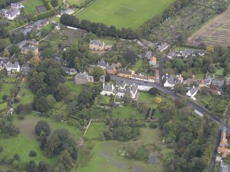 General oblique aerial view of Inveresk Village Road centred on the Manor House, looking to the NNE.