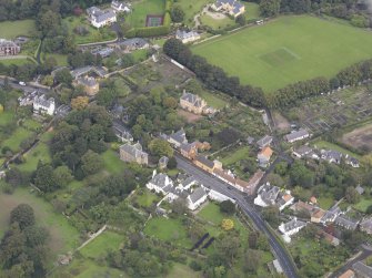 General oblique aerial view of Inveresk Village Road centred on the Manor House, looking to the N.