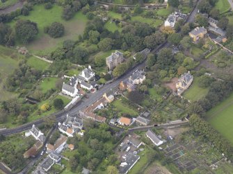 General oblique aerial view of Inveresk Village Road centred on the Manor House, looking to the WNW.
