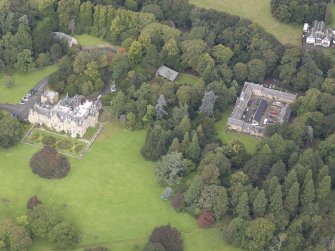 General oblique aerial view of Carberry Tower with adjacent stable block and Italian Garden, looking to the NW.