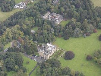 General oblique aerial view of Carberry Tower with adjacent stable block and Italian Garden, looking to the NE.