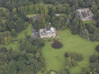 General oblique aerial view of Carberry Tower with adjacent stable block and Italian Garden, looking to the N.