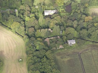 General oblique aerial view of Fountainhall Country House with adjacent dovecot, looking to the NW.
