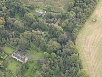 General oblique aerial view of Fountainhall Country House with adjacent dovecot, looking to the E.