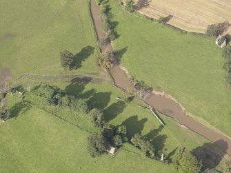 General oblique aerial view of Herdmanston dovecot with adjacent West Gate and Chapel, looking to the NW.