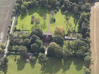 General oblique aerial view of Pilmuir House with adjacent dovecot, looking to the SSE.