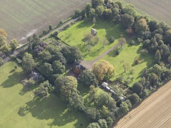 General oblique aerial view of Pilmuir House with adjacent dovecot, looking to the SE.