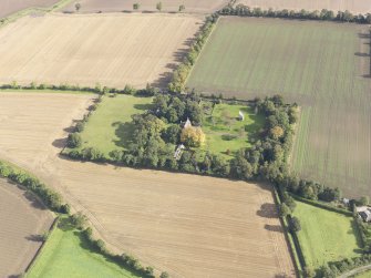 General oblique aerial view of Pilmuir House with adjacent dovecot, looking to the NE.