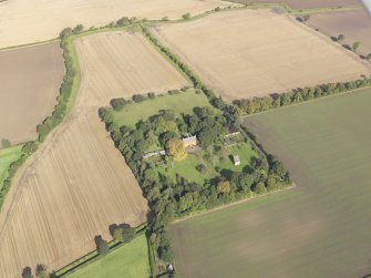 General oblique aerial view of Pilmuir House with adjacent dovecot, looking to the N.