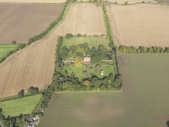 General oblique aerial view of Pilmuir House with adjacent dovecot, looking to the NNW.