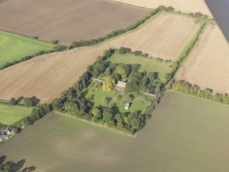 General oblique aerial view of Pilmuir House with adjacent dovecot, looking to the NW.