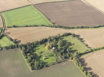 General oblique aerial view of Pilmuir House with adjacent dovecot, looking to the W.