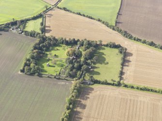 General oblique aerial view of Pilmuir House with adjacent dovecot, looking to the WSW.