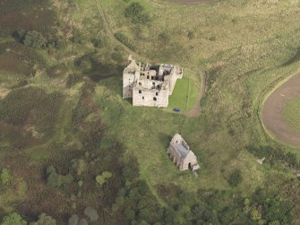 General oblique aerial view of Crichton Castle with The Slaughter House adjacent, looking to the N.