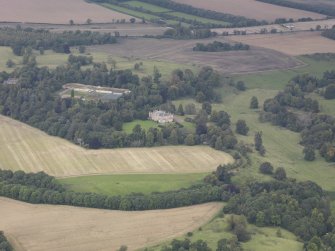 General oblique aerial view of Oxenfoord Castle with adjacent walled garden, looking to the N.
