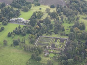 General oblique aerial view of Preston Hall with adjacent walled garden, looking to the SSE.
