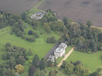 General oblique aerial view of Preston Hall with adjacent stables, looking to the NE.