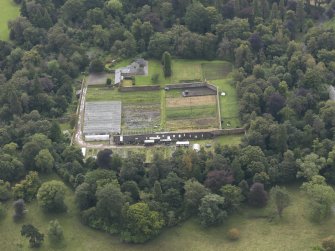 Oblique aerial view of Oxenfoord Castle walled garden, looking to the NE.
