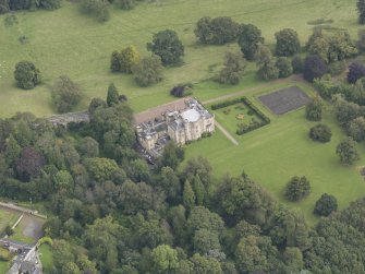 Oblique aerial view of Oxenfoord Castle, looking to the ENE.