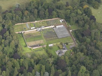 Oblique aerial view of Oxenfoord Castle walled garden, looking to the N.