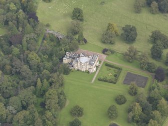 Oblique aerial view of Oxenfoord Castle, looking to the NNE.