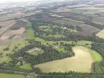 General oblique aerial view of Oxenfoord Castle and Preston House, looking to the NE.
