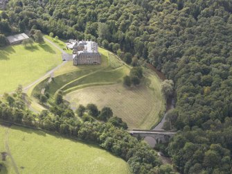 General oblique aerial view of Dalkeith House with adajacent Montague Bridge, looking to the SSW.