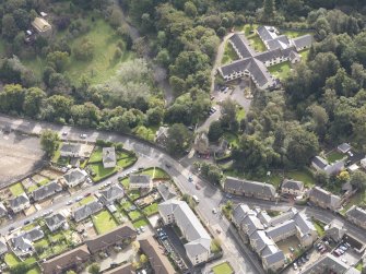 Oblique aerial view of Newbattle Abbey West Lodge, looking to the SSE.