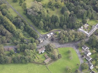 Oblique aerial view of Newbattle Abbey Port Gate North Lodge, looking to the E.