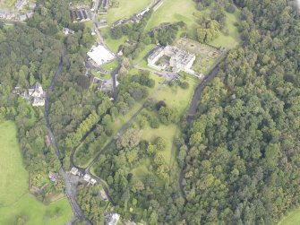 General oblique aerial view of Newbattle Abbey House with North Lodge adjacent, looking to the NE.
