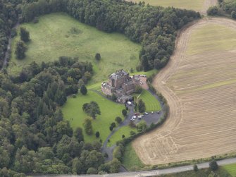 Oblique aerial view of Dalhousie Castle, looking to the SSW.