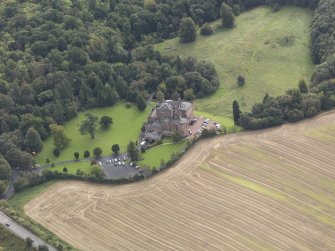 Oblique aerial view of Dalhousie Castle, looking to the S.