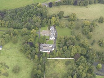 General oblique aerial view of Middleton Hall with adjacent stables, looking to the N.