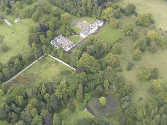 General oblique aerial view of Middleton Hall with adjacent stables and walled garden, looking to the NW.