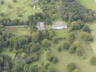 General oblique aerial view of Middleton Hall with adjacent stables and walled garden, looking to the W.