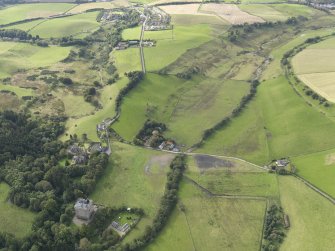 General oblique aerial view of Borthwick Castle with adjacent villages of Borthwick and North Middleton, looking to the SW.