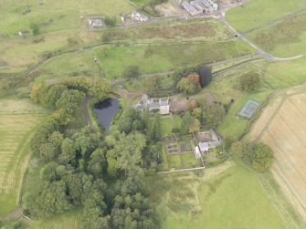 Oblique aerial view of Cakemuir Castle, looking to the NW.