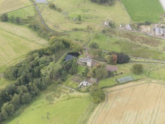 Oblique aerial view of Cakemuir Castle, looking to the W.