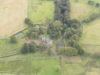 Oblique aerial view of Cakemuir Castle, looking to the E.