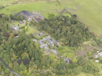 General oblique aerial view of Gowanbank steading with adjacent farmhouse and dairy, looking to the NE.