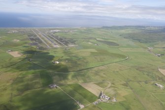 General oblique aerial view of Campbeltown Airport and Tangy Wind Farm, looking NW.