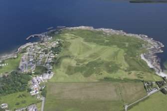 Oblique aerial view of Carradale Golf Course and Carradale Pier, looking E.