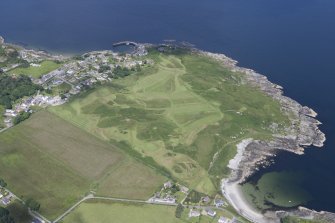 Oblique aerial view of Carradale Golf Course and Carradale Pier, looking NE.
