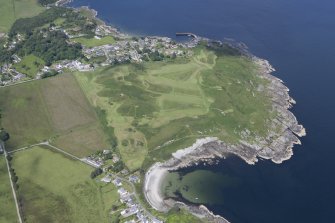 Oblique aerial view of Carradale Golf Course and Carradale Pier, looking NNE.