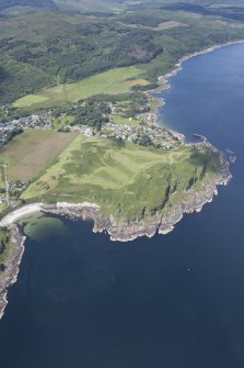 Oblique aerial view of Carradale Golf Course and Carradale Pier, looking NW.